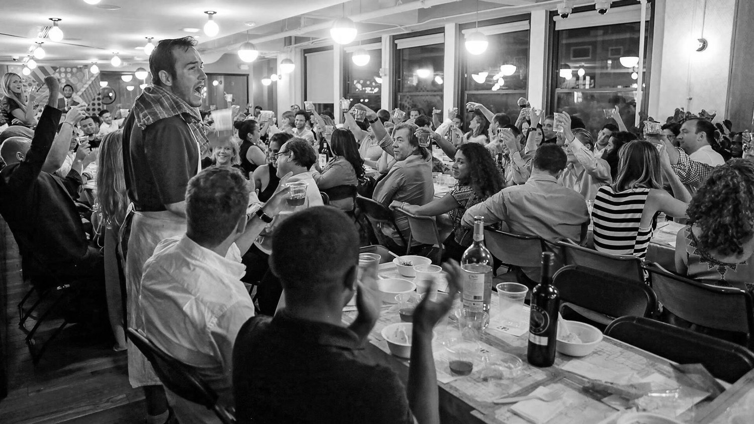 Guests raising a toast at a 7:47 dinner